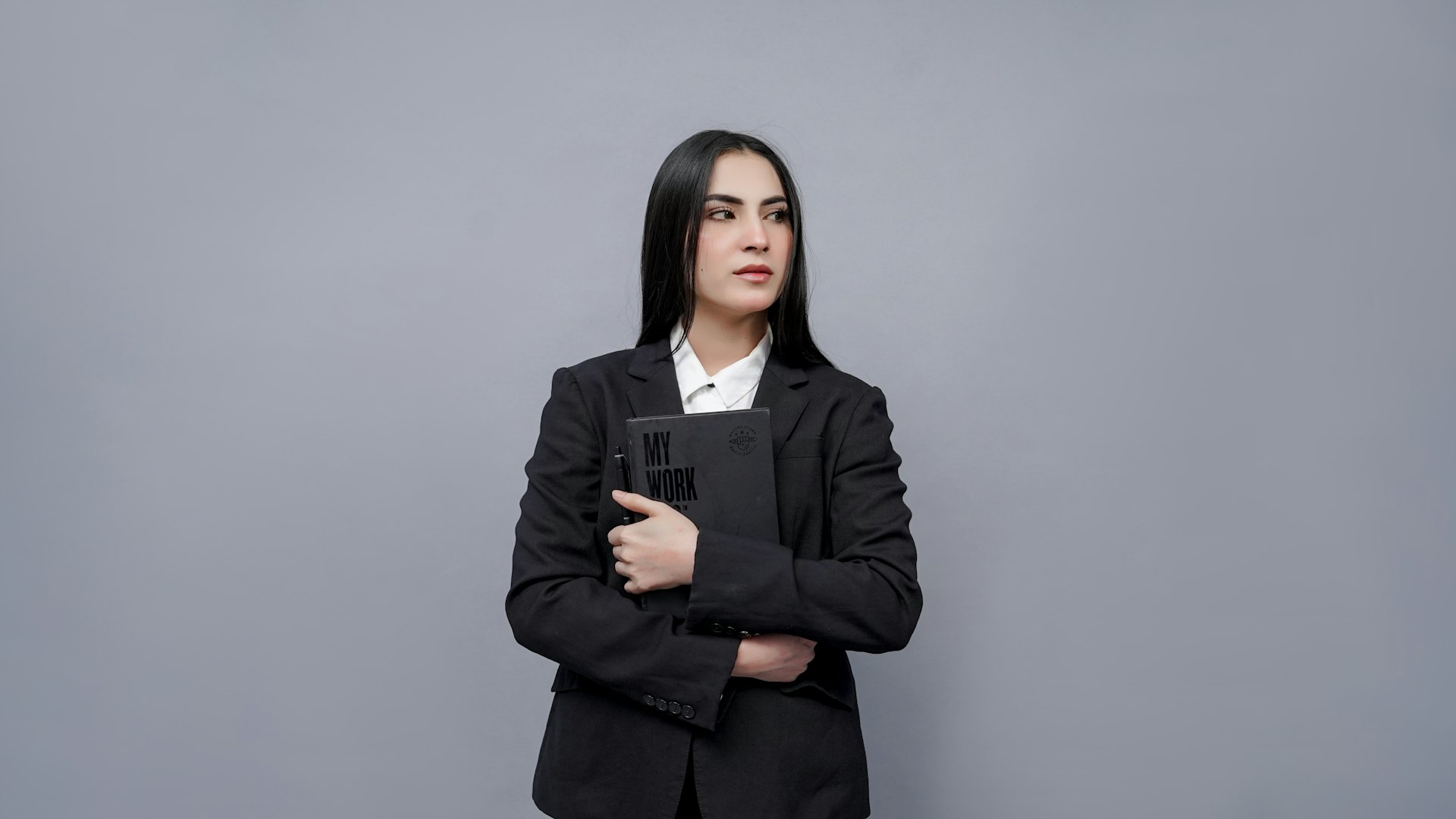 a person holding a laptop